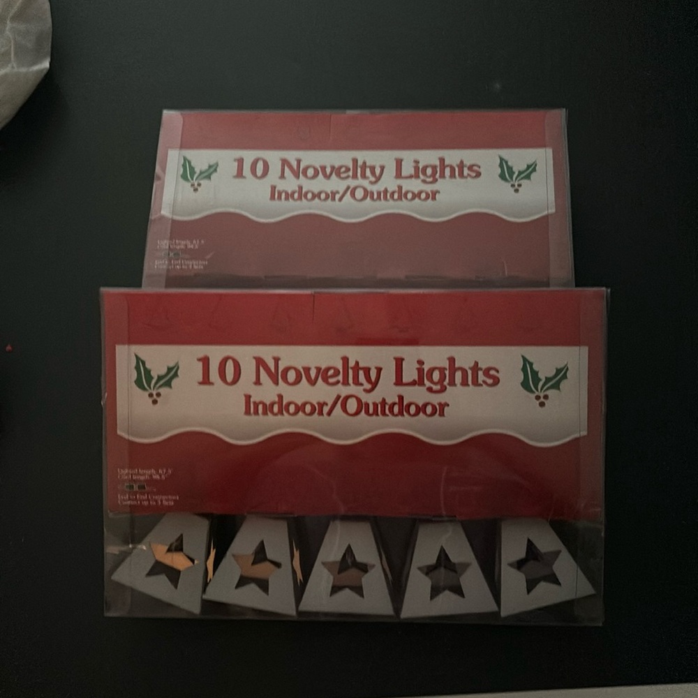 String lights. Tin star design. 2 boxes. NEW.